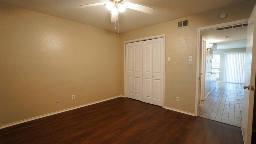 2505 Wedglea Drive, Unit 121 Dallas, TX 75211 - Photo 16 of 24 wooden floor in an empty room