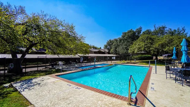 a view of a swimming pool with chairs