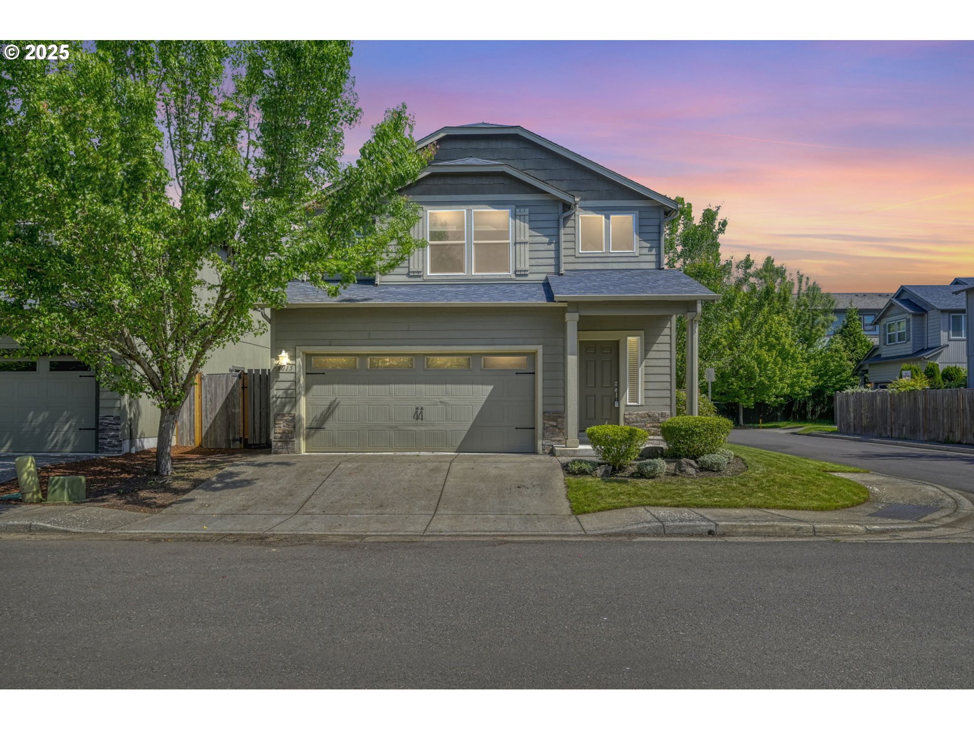 a front view of a house with a garden