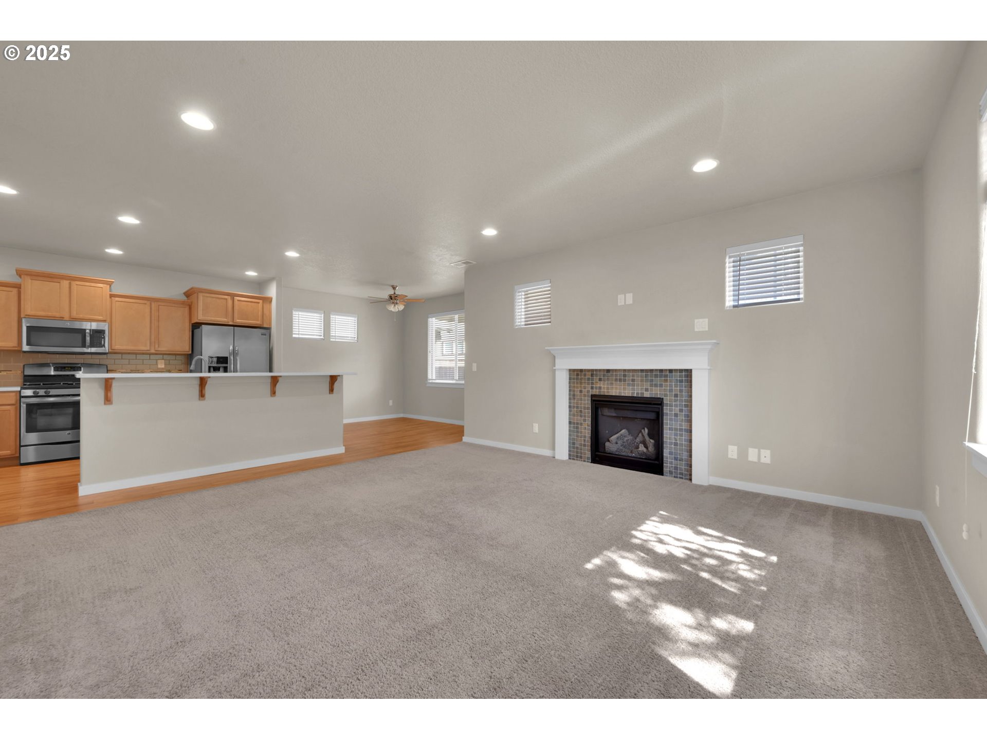3015 Guadalupe Way Eugene, OR 97408 - Photo 13 of 48 a view of a kitchen with a sink and a fireplace
