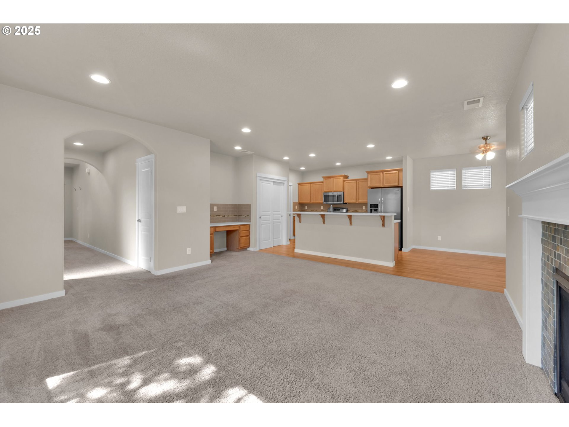 3015 Guadalupe Way Eugene, OR 97408 - Photo 14 of 48 a view of large hall with stainless steel appliances refrigerator