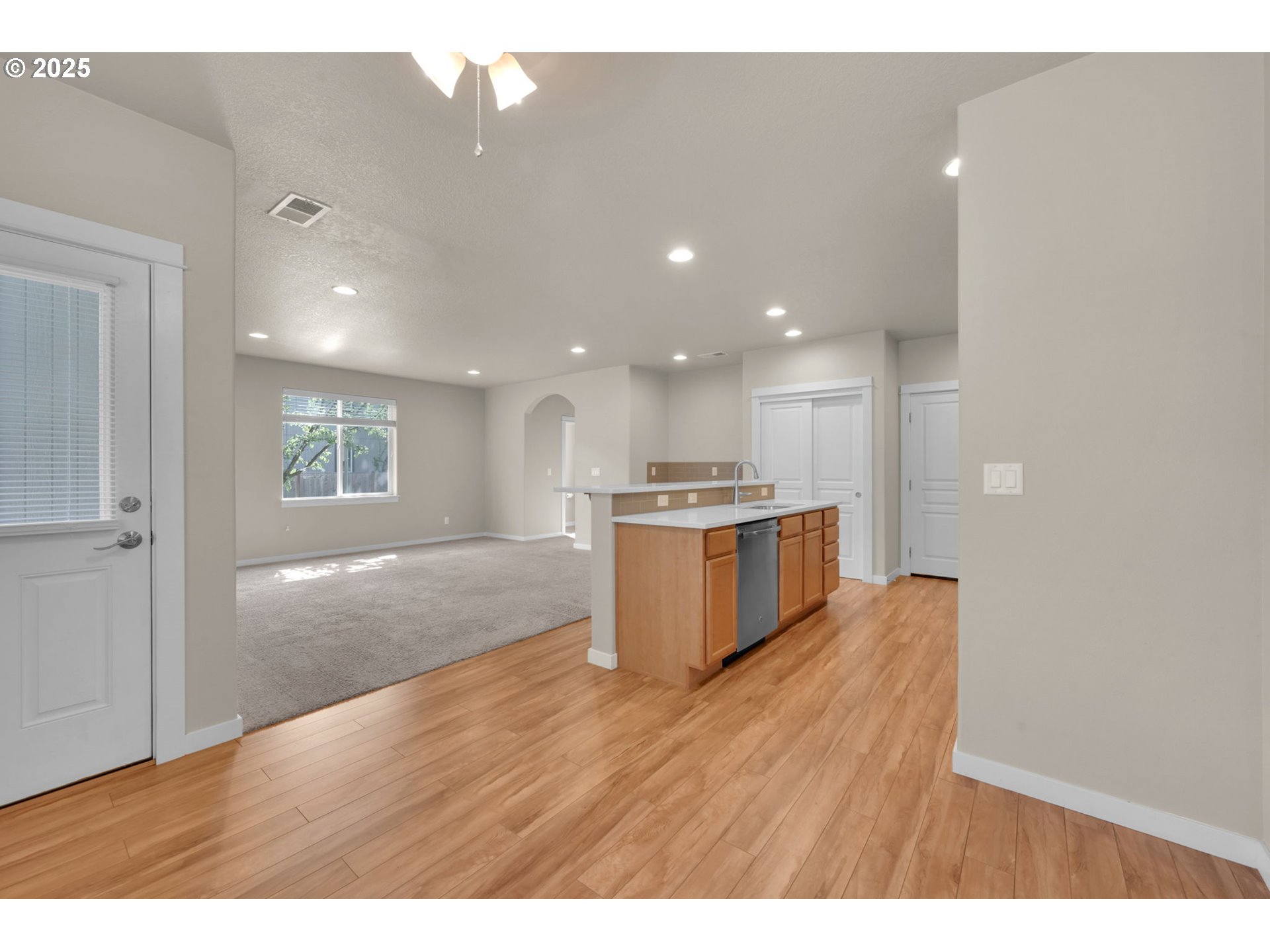 3015 Guadalupe Way Eugene, OR 97408 - Photo 15 of 48 a view of kitchen with kitchen island wooden floor and window