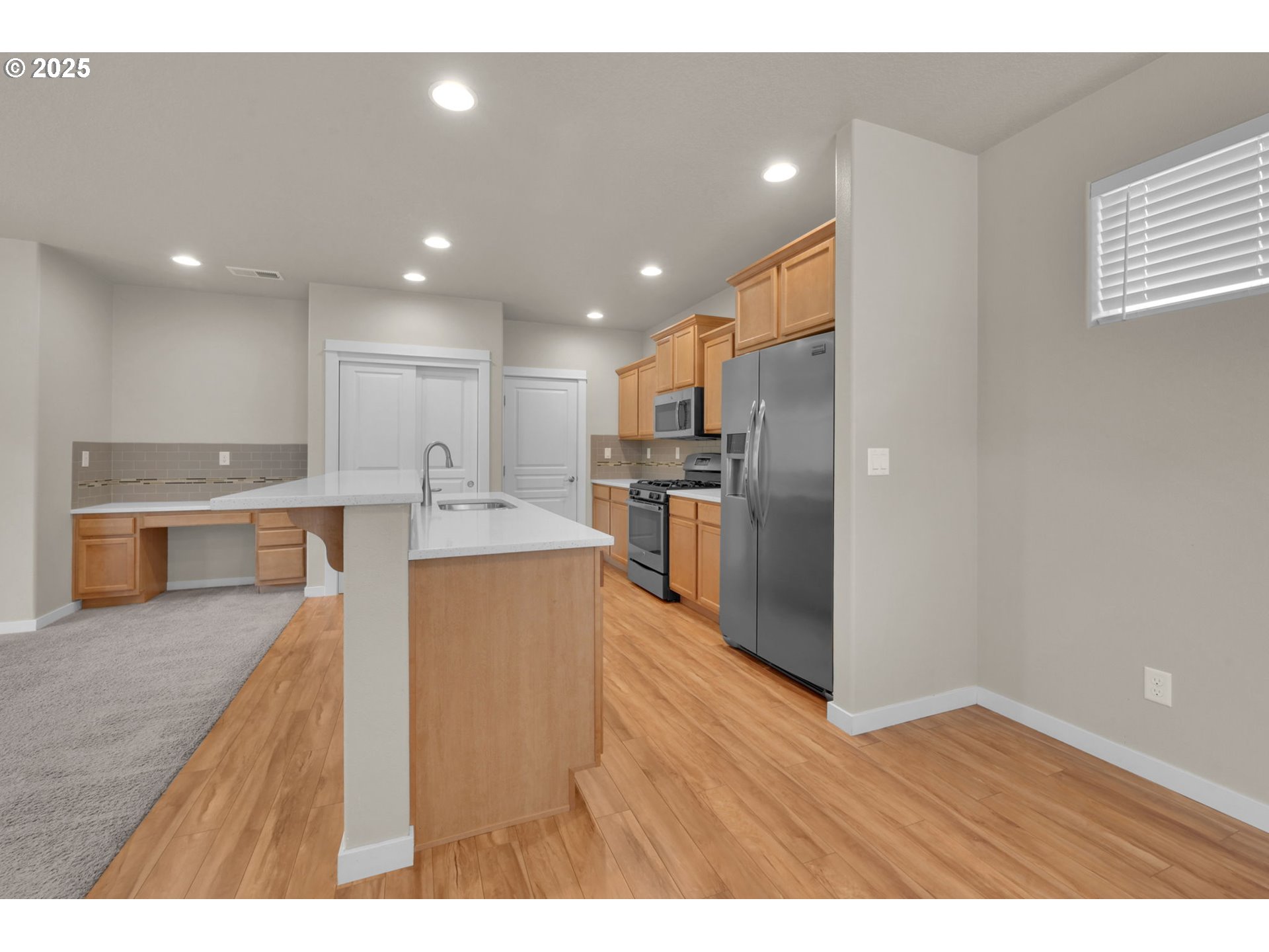 3015 Guadalupe Way Eugene, OR 97408 - Photo 16 of 48 a kitchen with stainless steel appliances granite countertop a refrigerator a sink a stove and oven