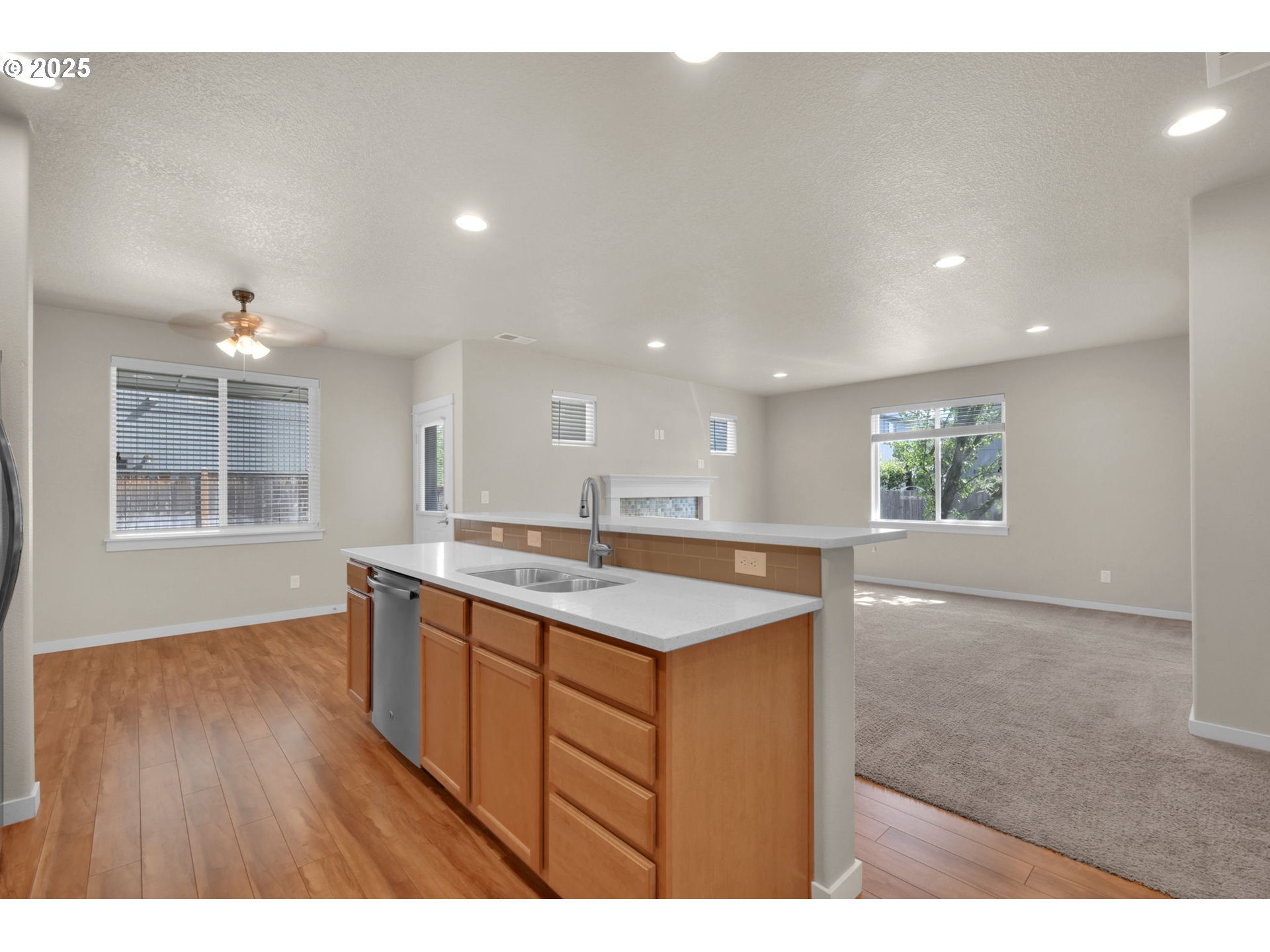 3015 Guadalupe Way Eugene, OR 97408 - Photo 18 of 48 a kitchen with a sink cabinets and wooden floor