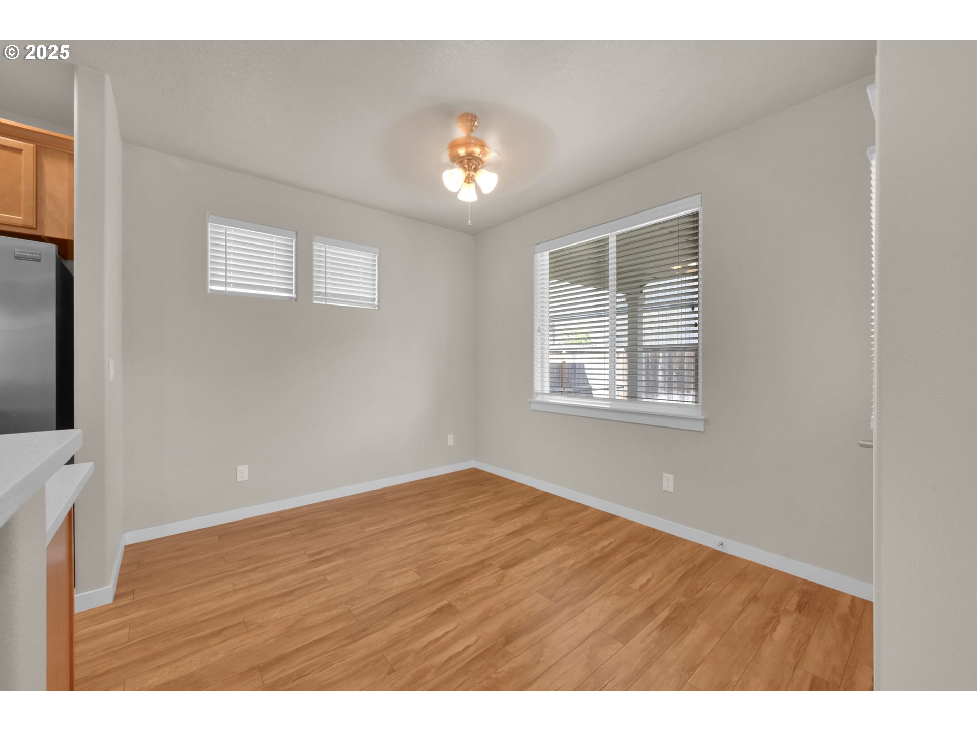 3015 Guadalupe Way Eugene, OR 97408 - Photo 22 of 48 a view of an empty room with wooden floor and a window