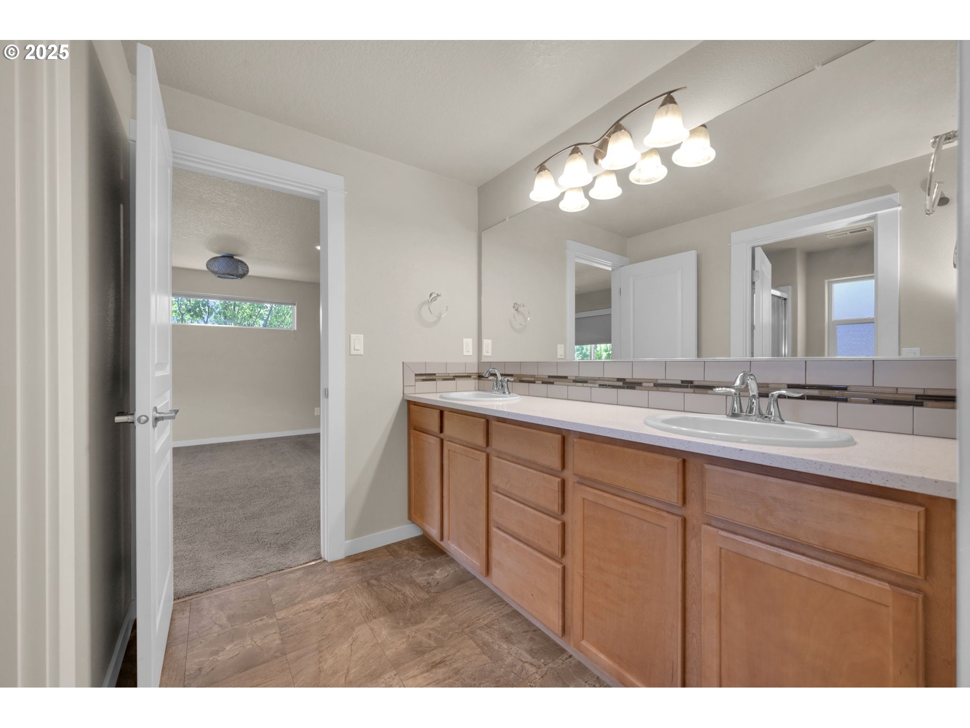 3015 Guadalupe Way Eugene, OR 97408 - Photo 28 of 48 a bathroom with a sink vanity and a mirror