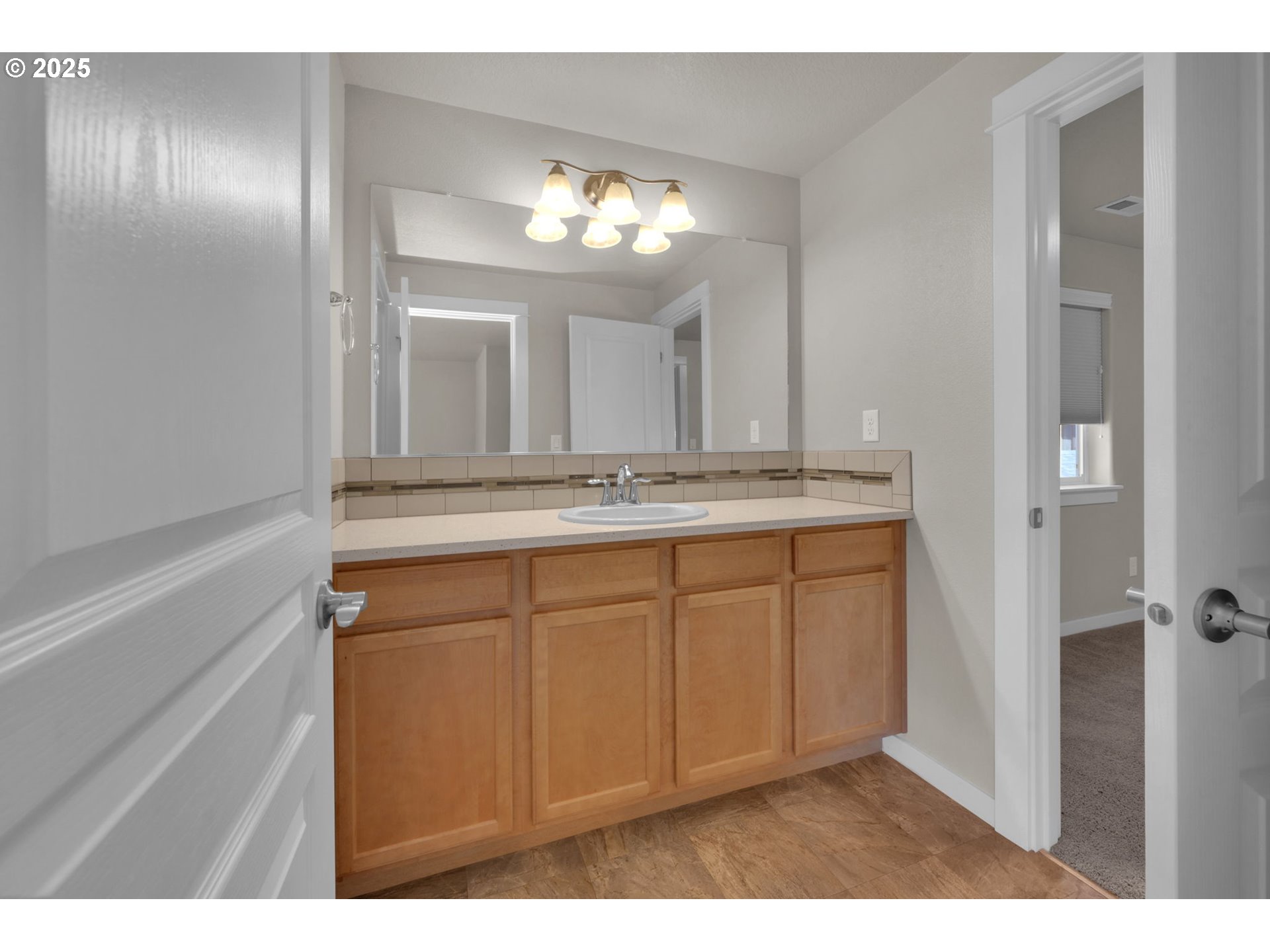 3015 Guadalupe Way Eugene, OR 97408 - Photo 36 of 48 a bathroom with a sink and a mirror
