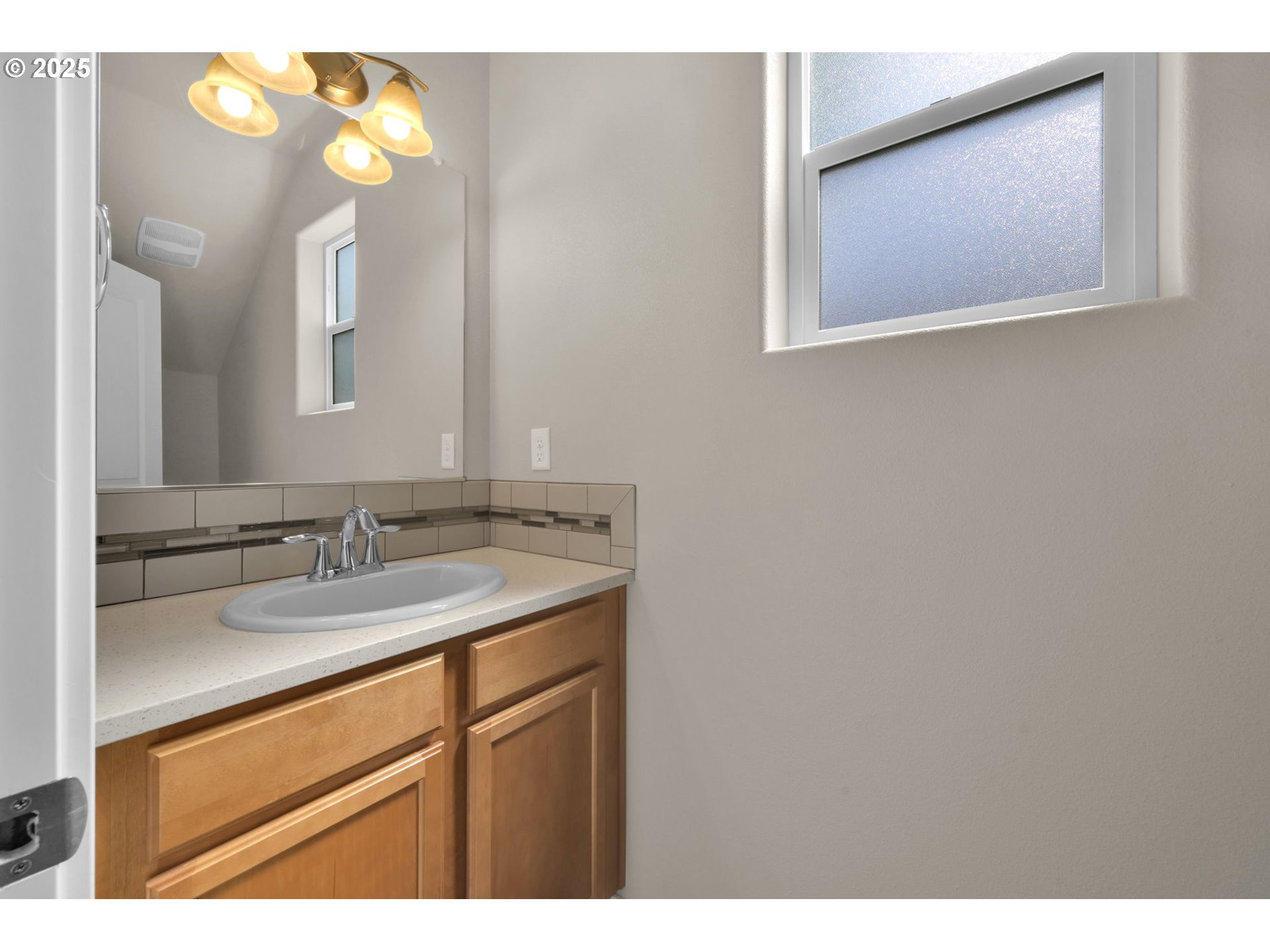 3015 Guadalupe Way Eugene, OR 97408 - Photo 8 of 48 a bathroom with a granite countertop sink and a mirror
