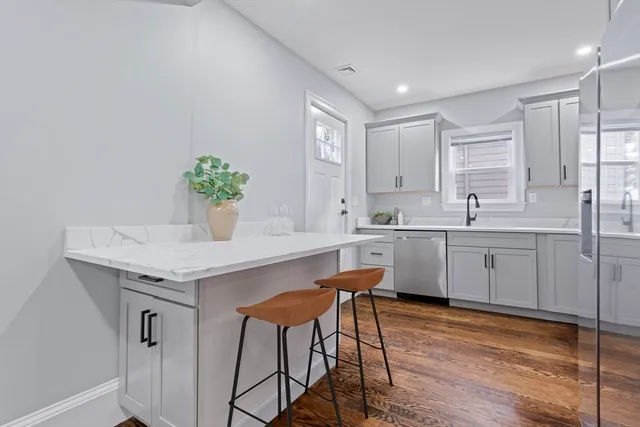a kitchen with a table and chairs in it