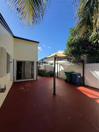 a view of yard from a corridor