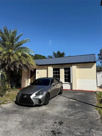 a car parked in front of a house