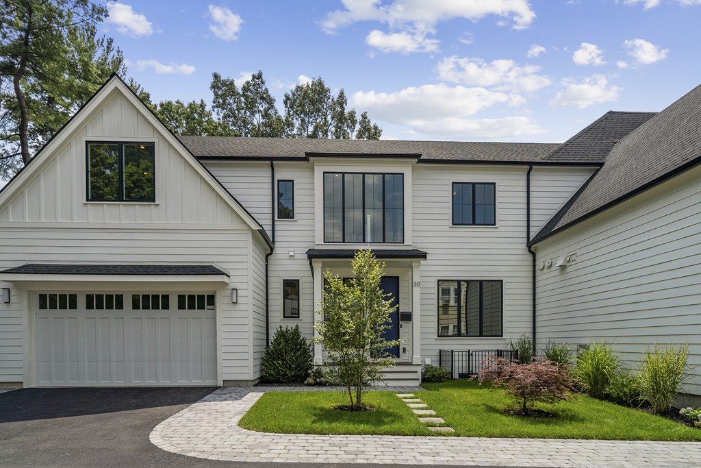 30 Coyne Road, Unit 30 Newton, MA 02468 - Photo 1 of 25 a front view of a house with a yard