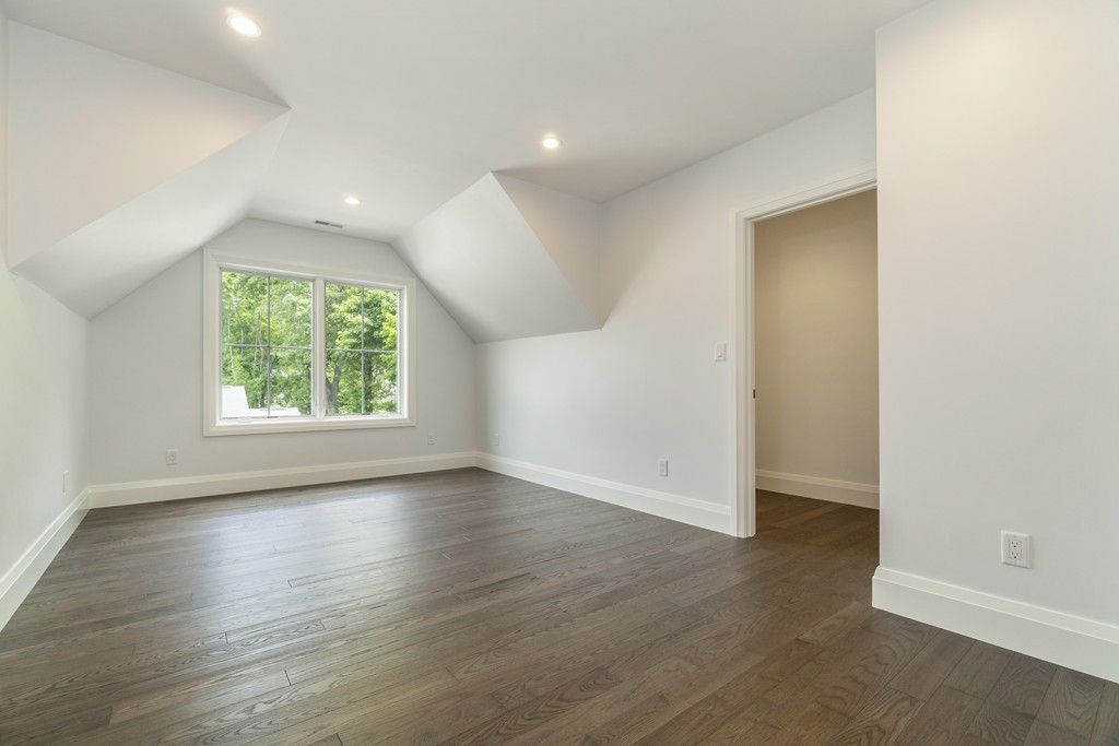 30 Coyne Road, Unit 30 Newton, MA 02468 - Photo 15 of 25 an empty room with wooden floor and windows