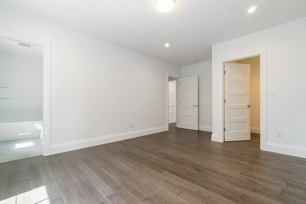 30 Coyne Road, Unit 30 Newton, MA 02468 - Photo 17 of 25 a view of an empty room with wooden floor