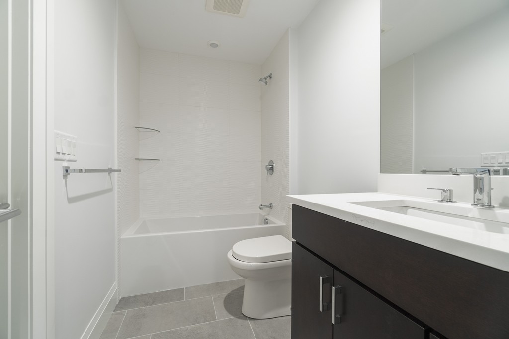 30 Coyne Road, Unit 30 Newton, MA 02468 - Photo 21 of 25 a bathroom with a sink a toilet and shower