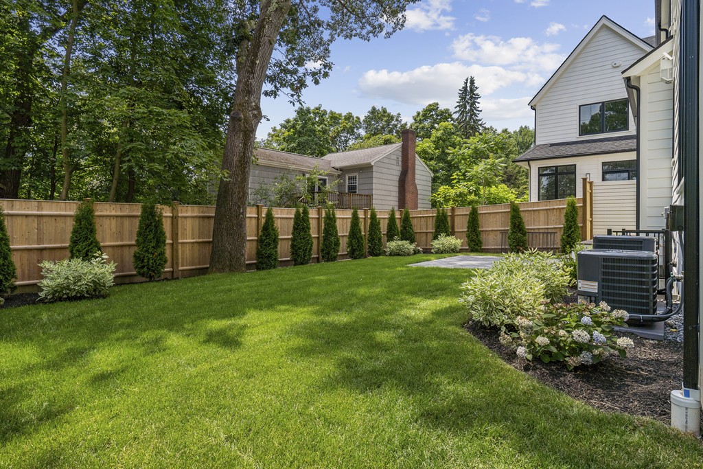 30 Coyne Road, Unit 30 Newton, MA 02468 - Photo 22 of 25 a view of a house with a back yard