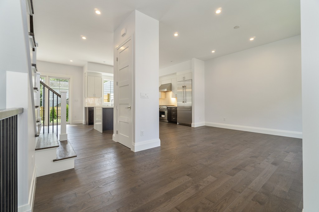 30 Coyne Road, Unit 30 Newton, MA 02468 - Photo 3 of 25 a view of a hallway with wooden floor windows and a living room