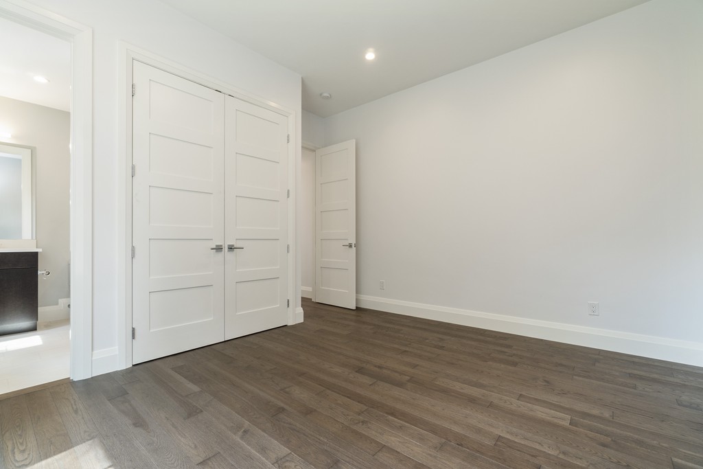 30 Coyne Road, Unit 30 Newton, MA 02468 - Photo 8 of 25 an empty room with wooden floor