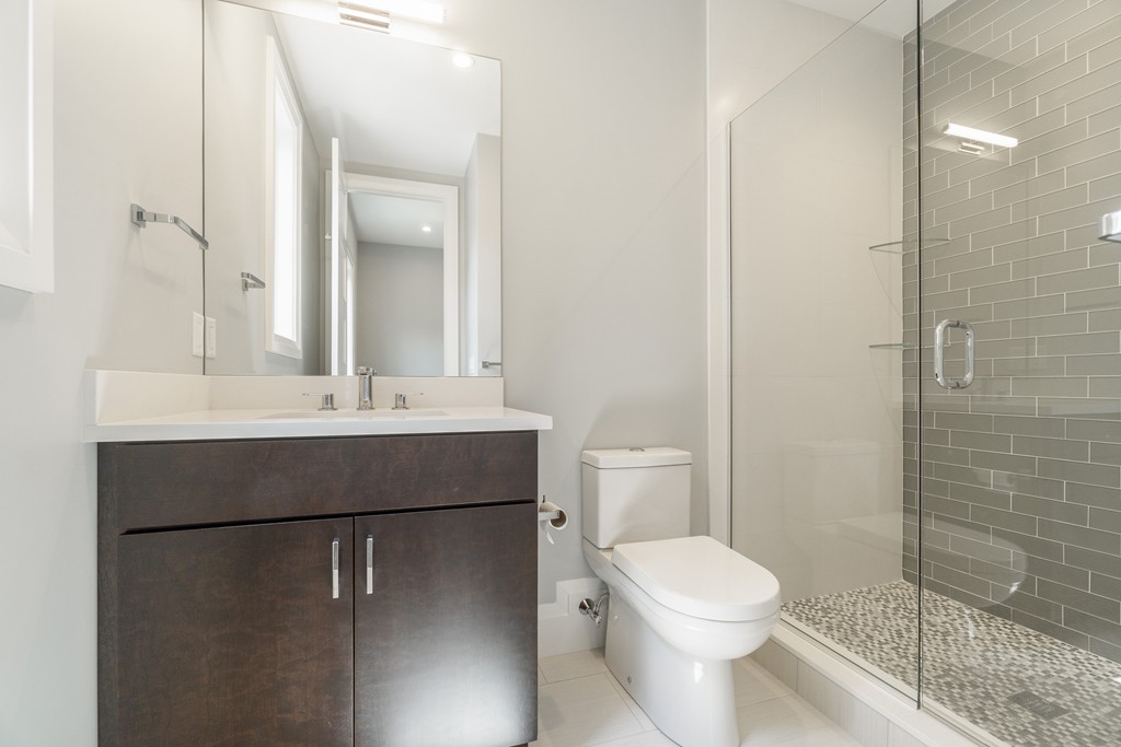 30 Coyne Road, Unit 30 Newton, MA 02468 - Photo 9 of 25 a bathroom with a sink toilet and shower