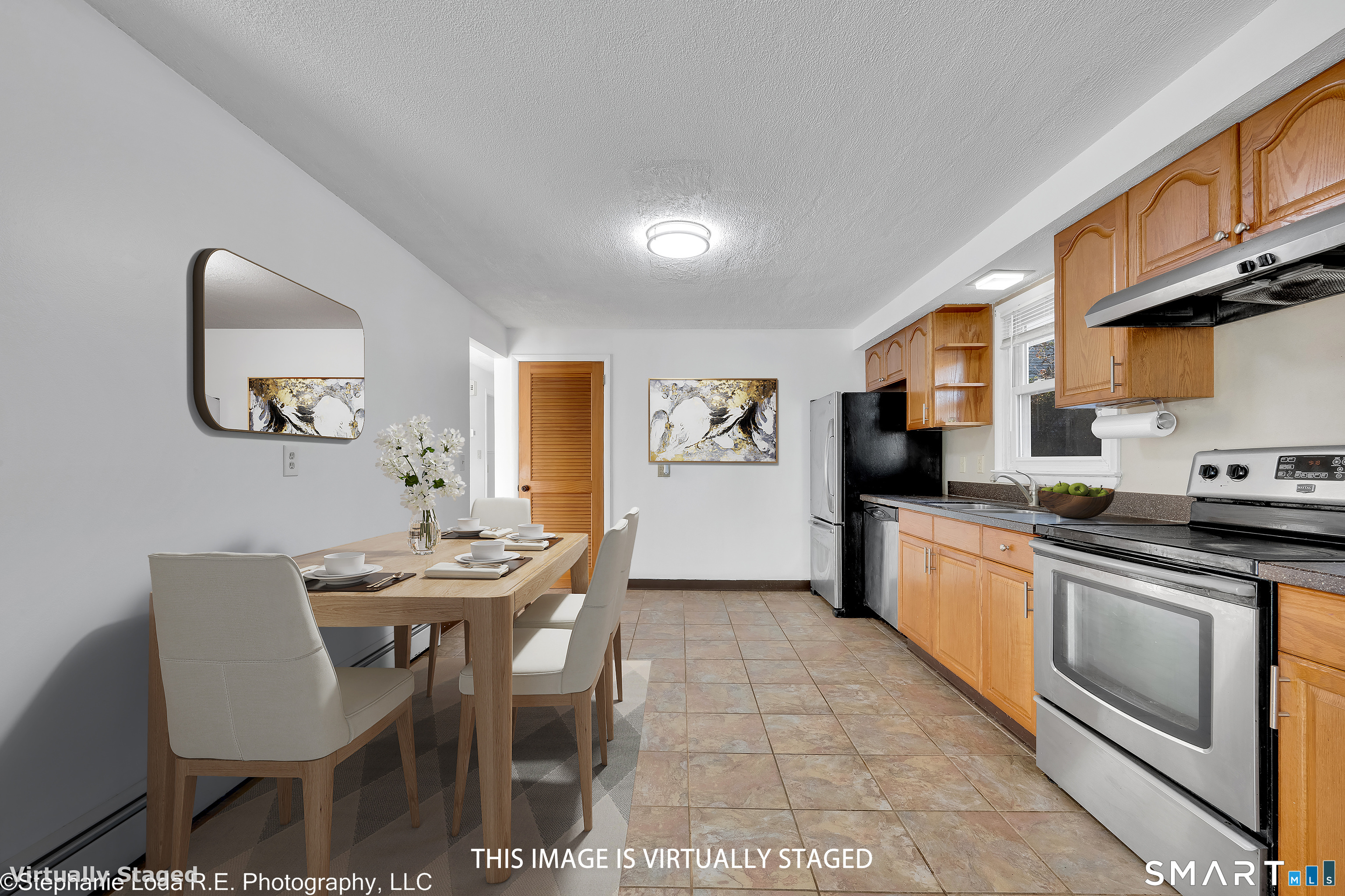 12 Nutmeg Drive Clinton, CT 06413 - Photo 11 of 26 a kitchen with stainless steel appliances kitchen island granite countertop a sink and cabinets