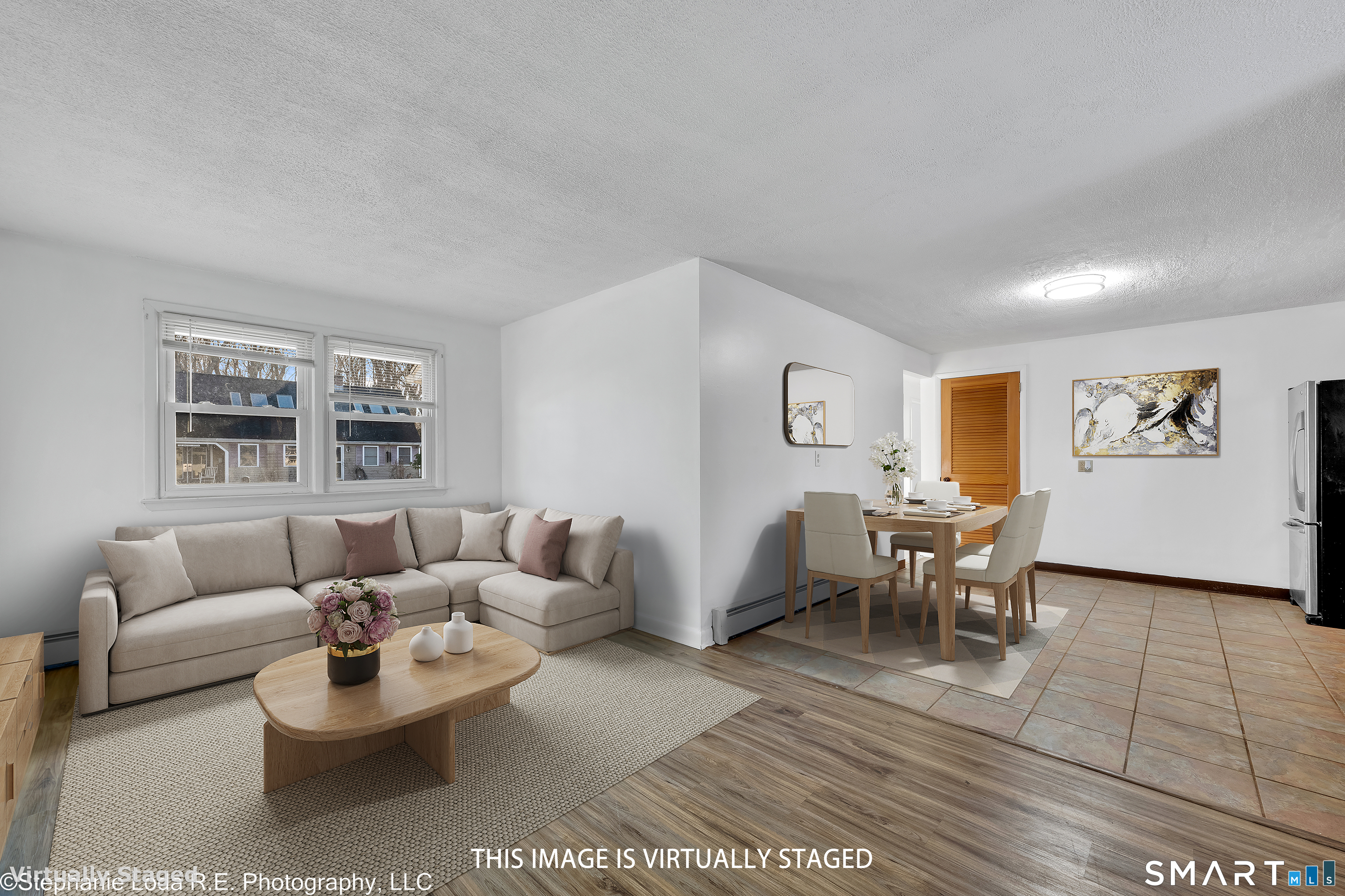 12 Nutmeg Drive Clinton, CT 06413 - Photo 13 of 26 a living room with furniture and a large window