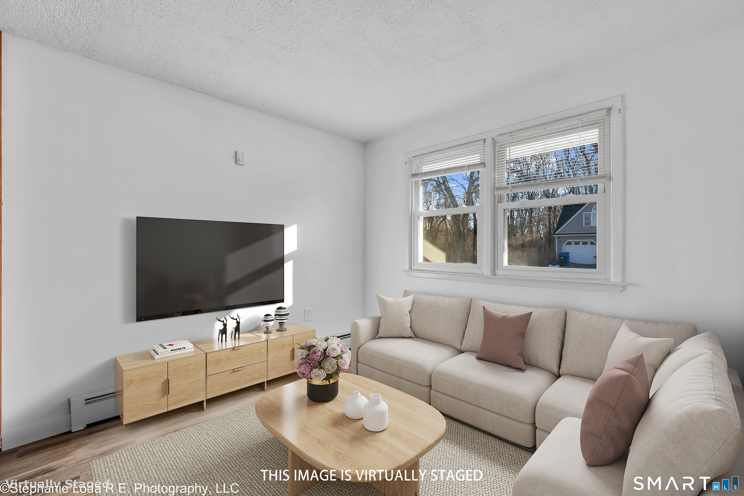 12 Nutmeg Drive Clinton, CT 06413 - Photo 15 of 26 a living room with furniture and a flat screen tv