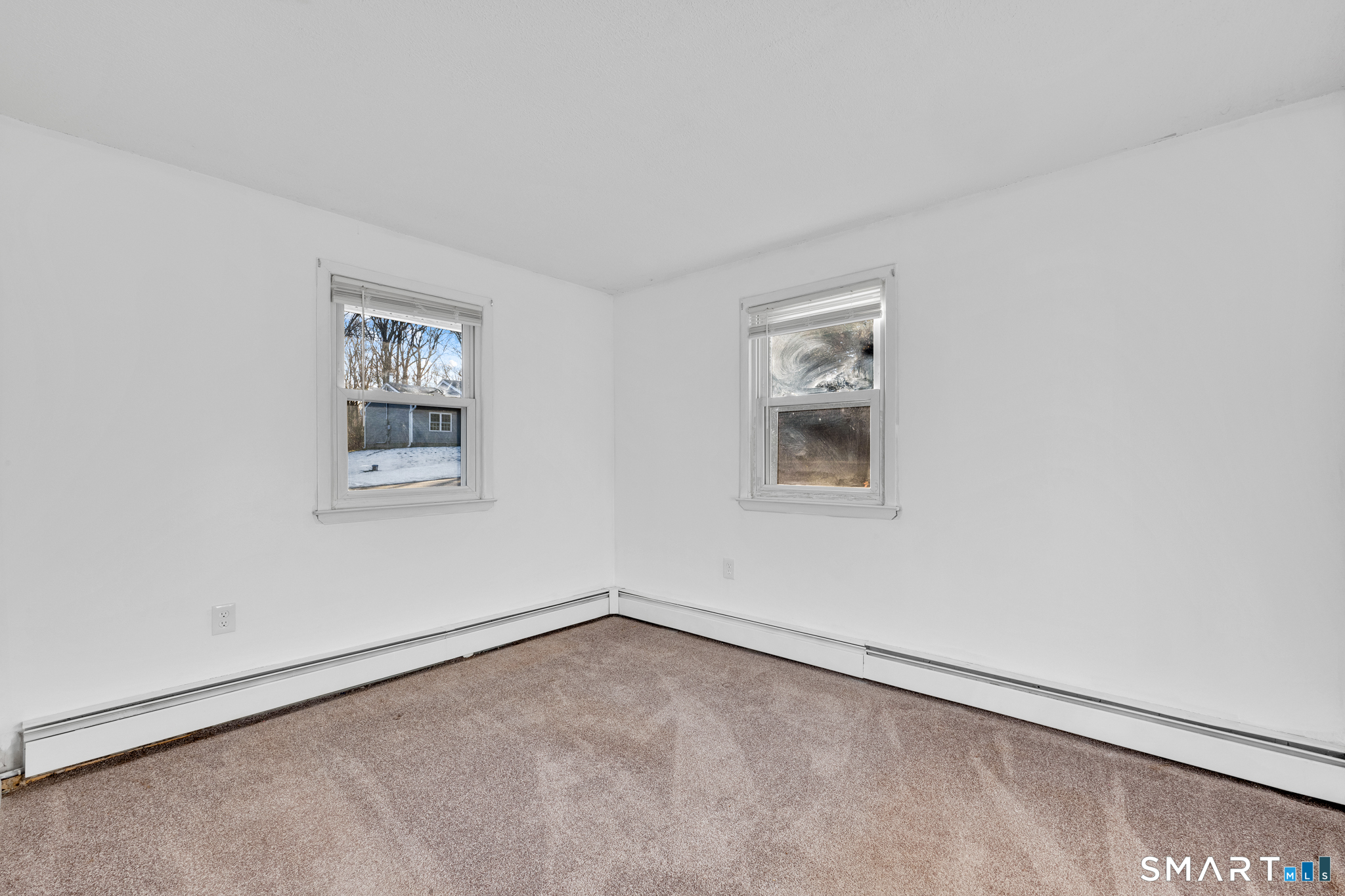 12 Nutmeg Drive Clinton, CT 06413 - Photo 17 of 26 an empty room with a window