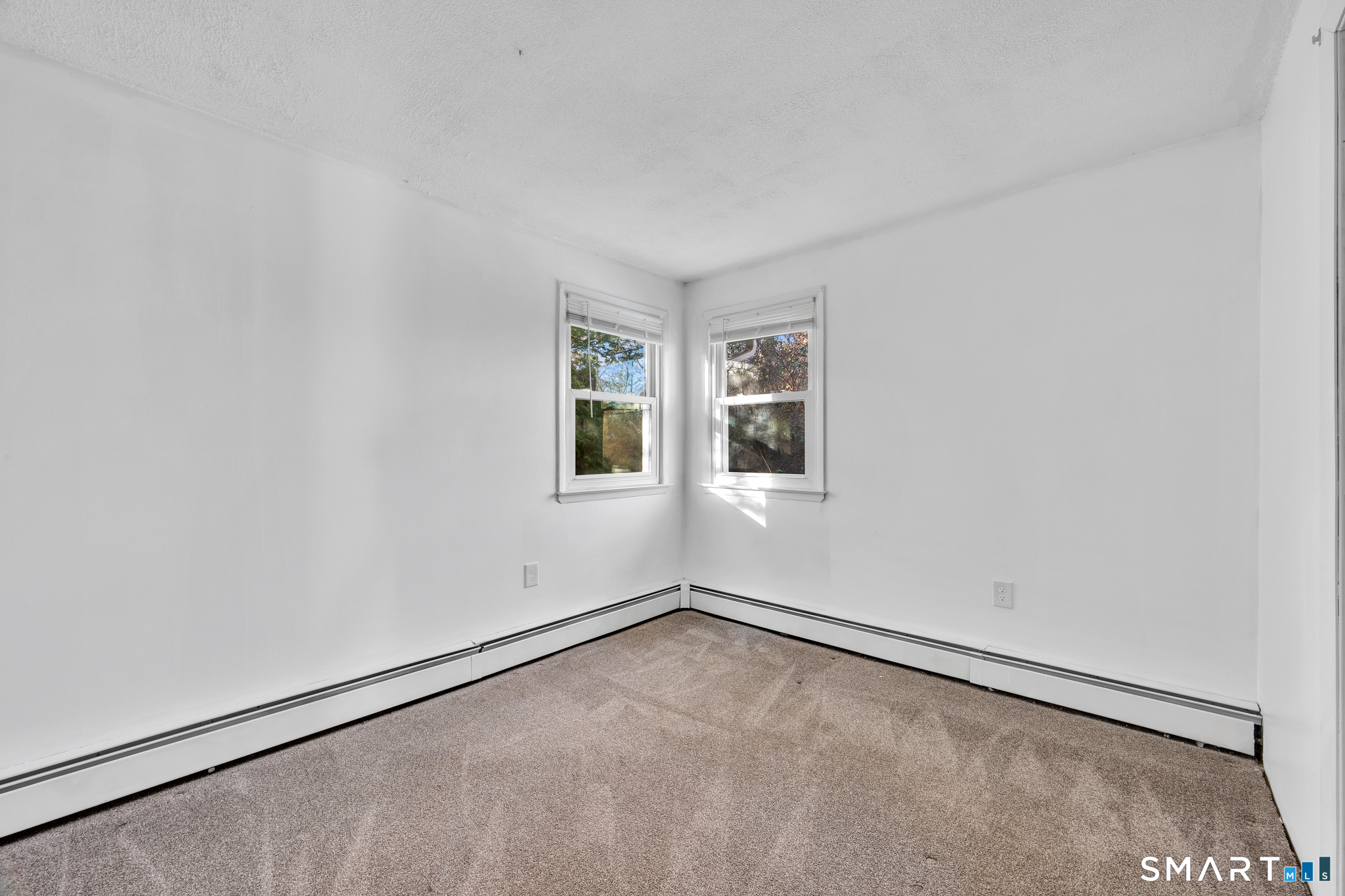12 Nutmeg Drive Clinton, CT 06413 - Photo 19 of 26 an empty room with windows