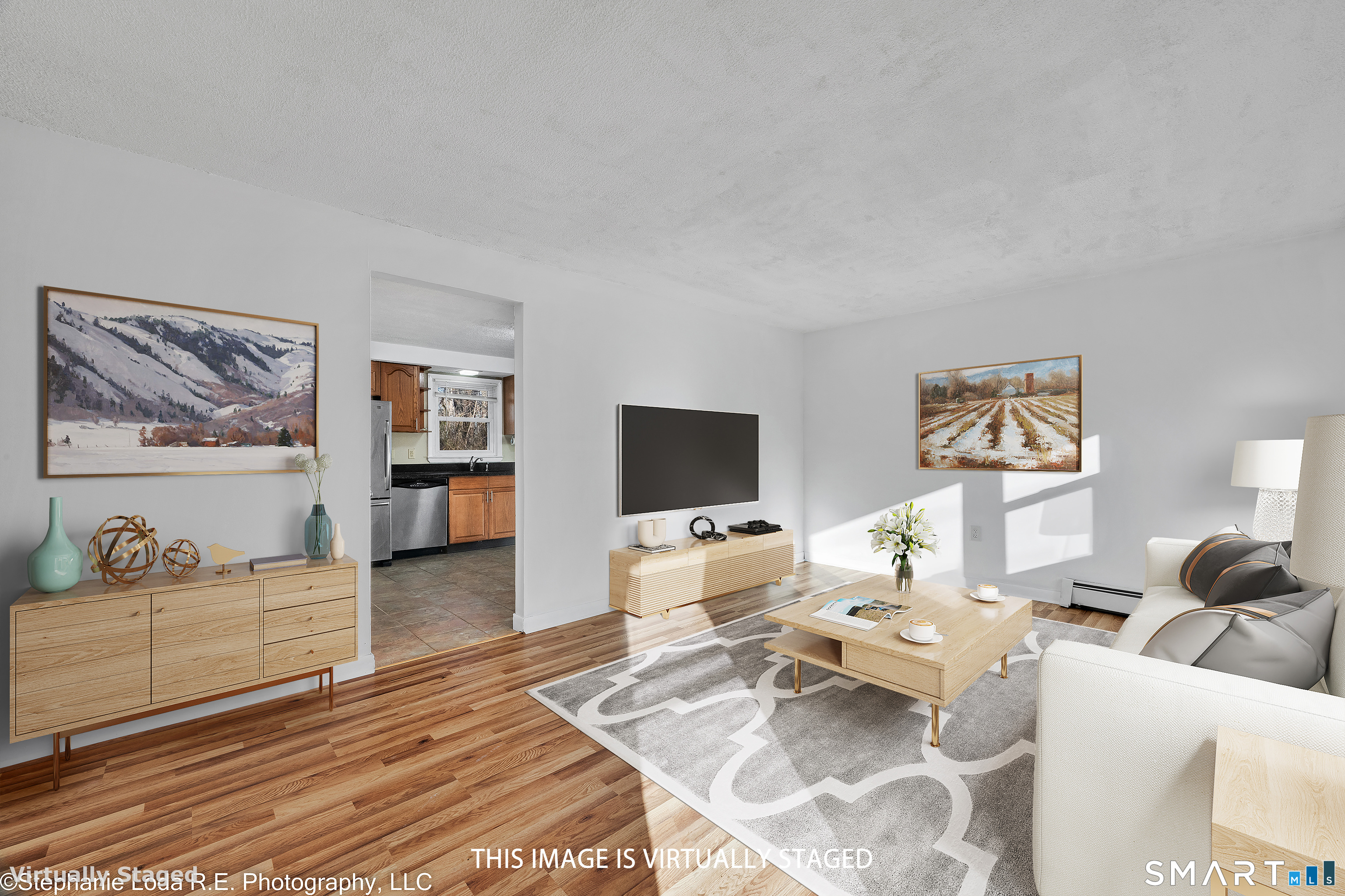 12 Nutmeg Drive Clinton, CT 06413 - Photo 6 of 26 a living room with furniture and a flat screen tv