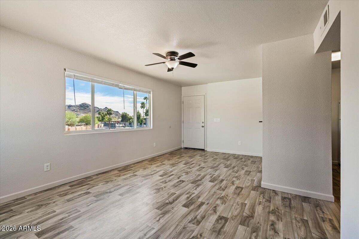 1346 East Mountain View Road, Unit 210 Phoenix, AZ 85020 - Photo 12 of 31 a view of an empty room with a window