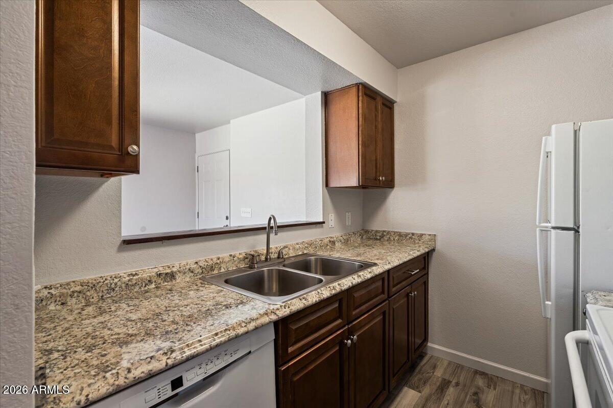 1346 East Mountain View Road, Unit 210 Phoenix, AZ 85020 - Photo 19 of 31 a kitchen with a sink and cabinets