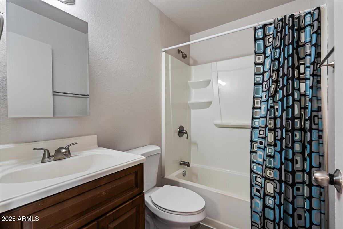 1346 East Mountain View Road, Unit 210 Phoenix, AZ 85020 - Photo 22 of 31 a bathroom with a sink toilet vanity and shower