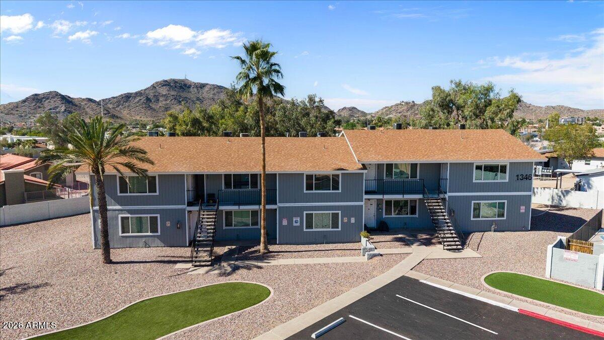1346 East Mountain View Road, Unit 210 Phoenix, AZ 85020 - Photo 7 of 31 a view of a house with swimming pool and a sitting area
