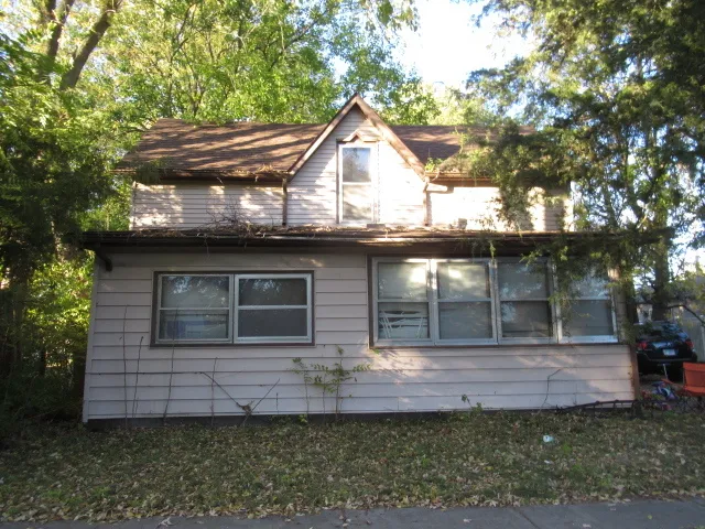 a front view of a house with garage