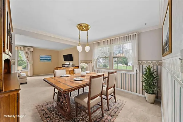 a very nice looking room with a large window and chandelier