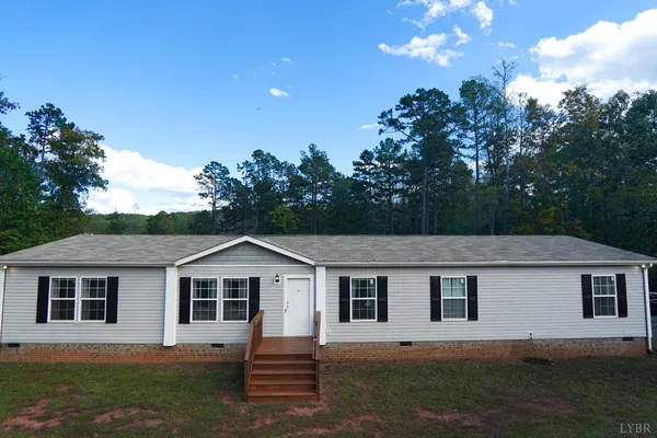 a front view of a house with yard