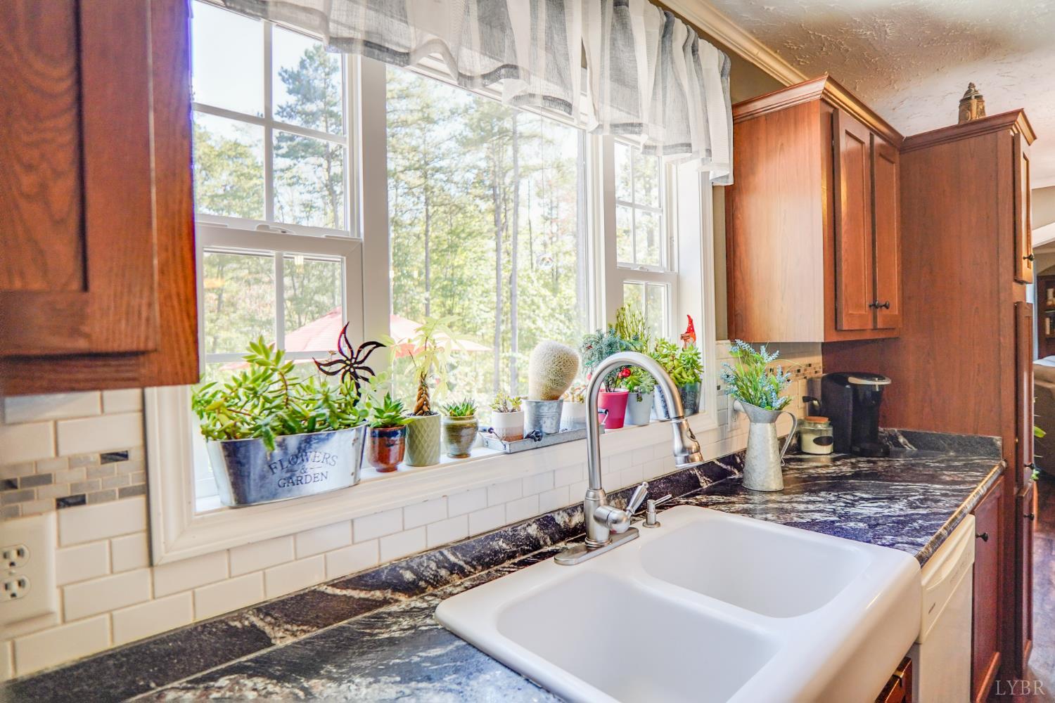 159 Hidden Trail Rustburg, VA 24588 - Photo 15 of 34 a bathroom with a granite countertop sink a mirror and a shower