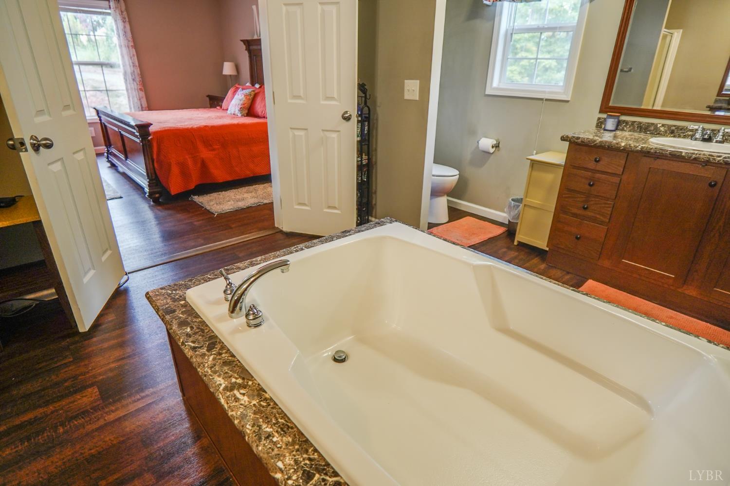 159 Hidden Trail Rustburg, VA 24588 - Photo 24 of 34 a bedroom with bed and wooden floor