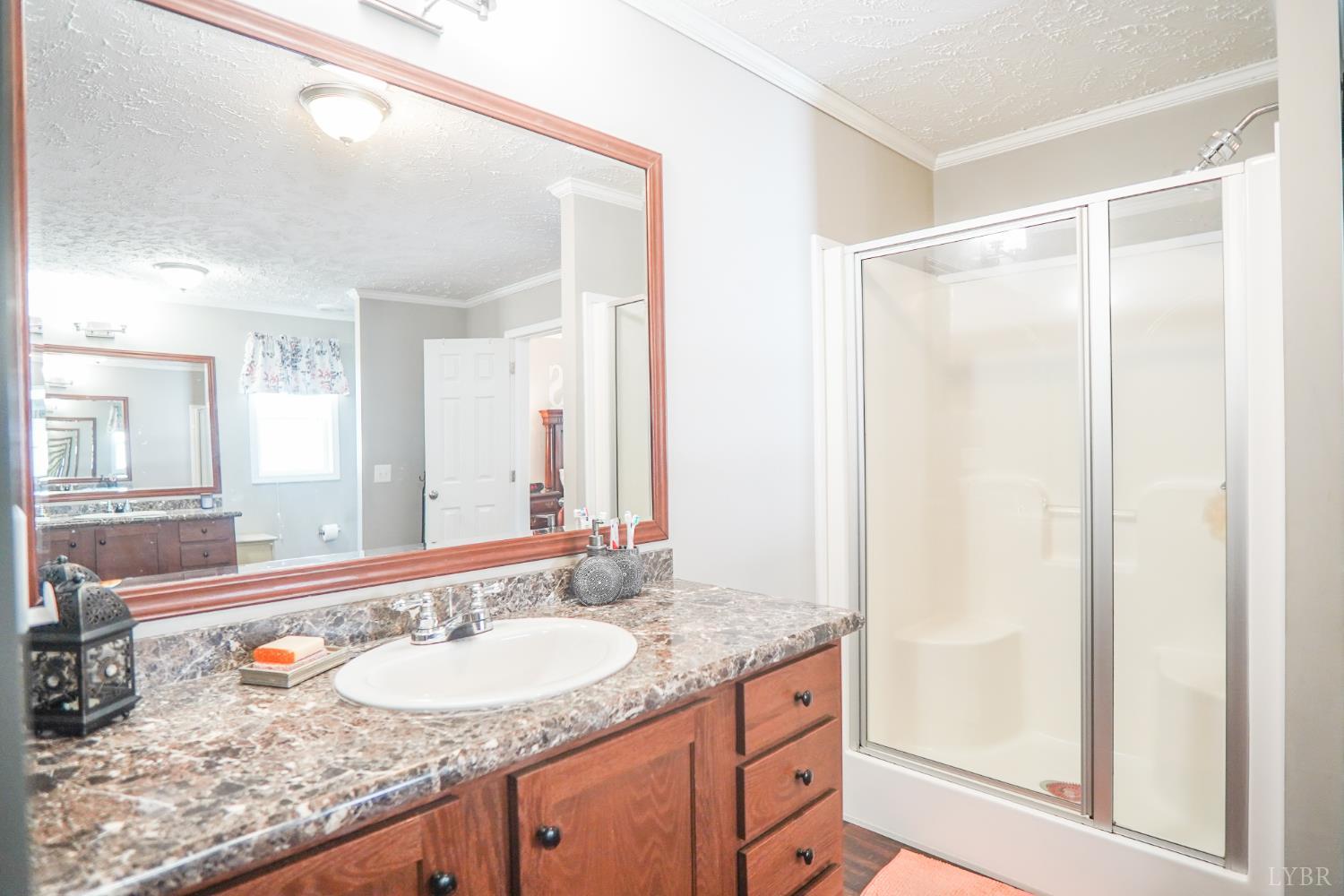 159 Hidden Trail Rustburg, VA 24588 - Photo 25 of 34 a bathroom with a granite countertop sink and a mirror