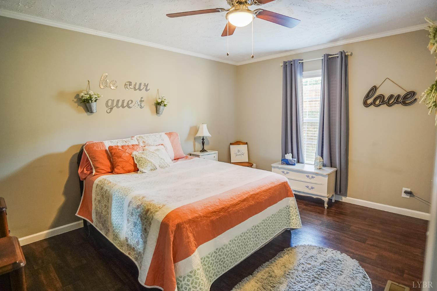 159 Hidden Trail Rustburg, VA 24588 - Photo 29 of 34 a bedroom with a bed and a chandelier