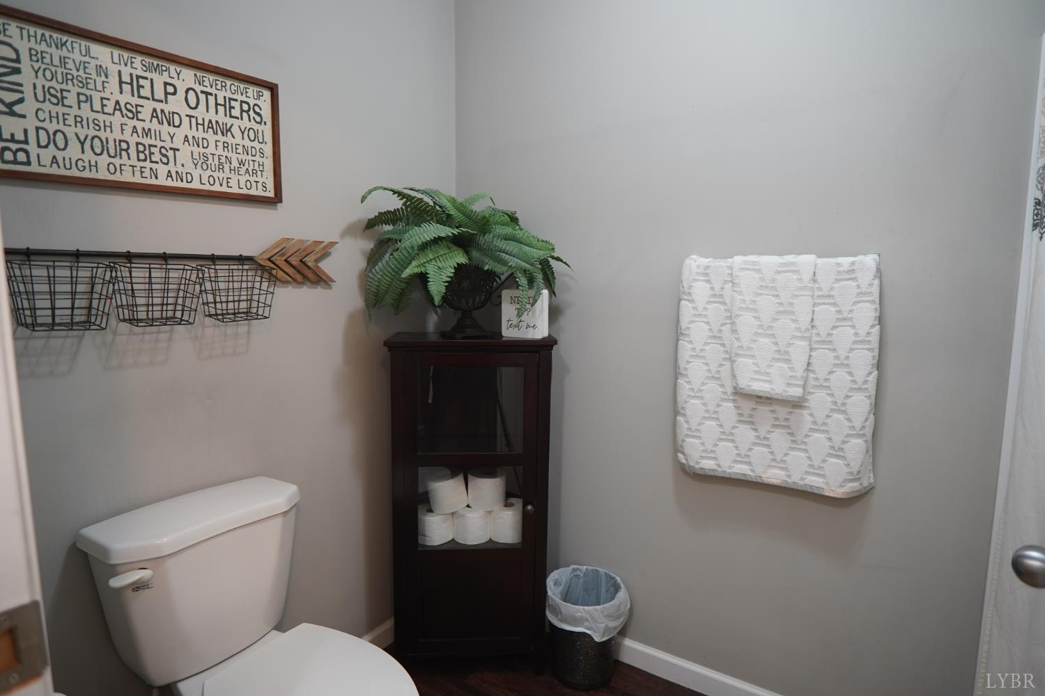 159 Hidden Trail Rustburg, VA 24588 - Photo 30 of 34 a white toilet sitting next to a shower curtain