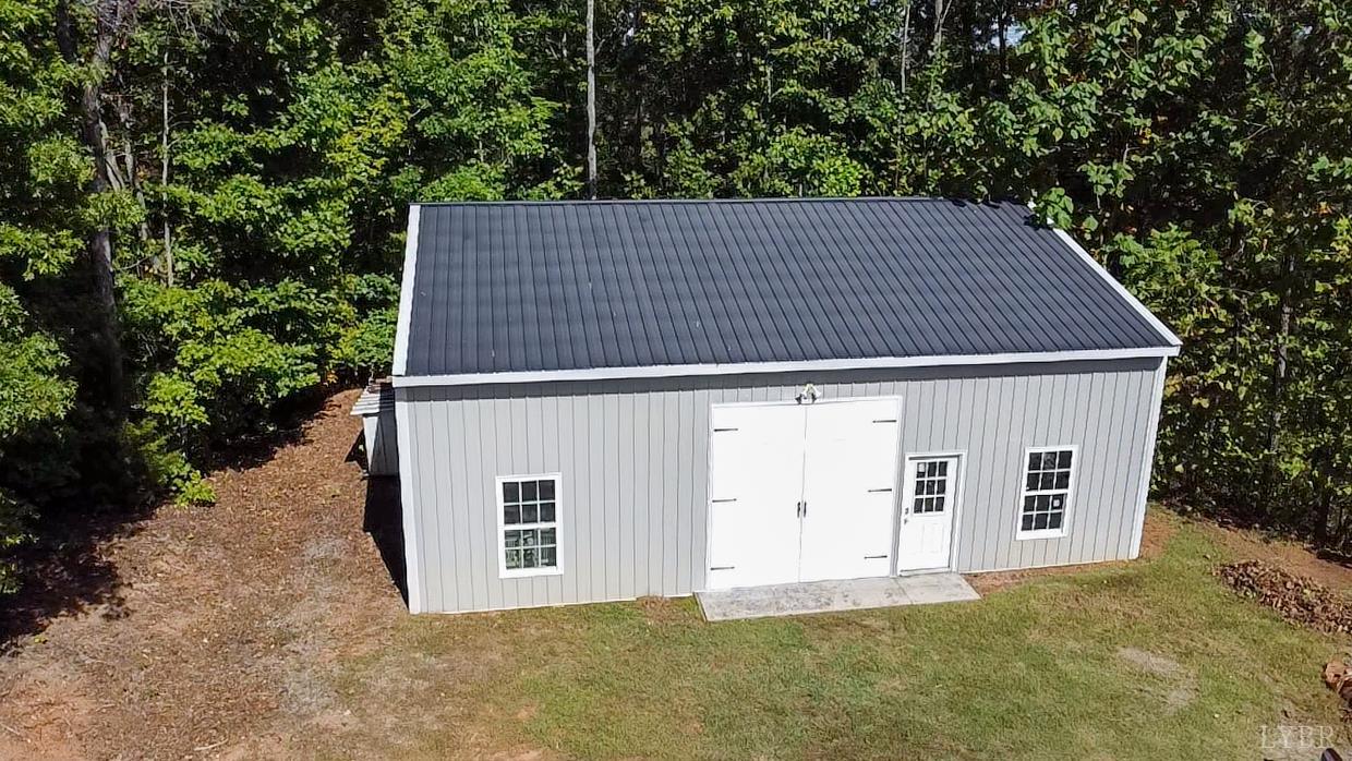 159 Hidden Trail Rustburg, VA 24588 - Photo 3 of 34 a backyard of a house with large trees