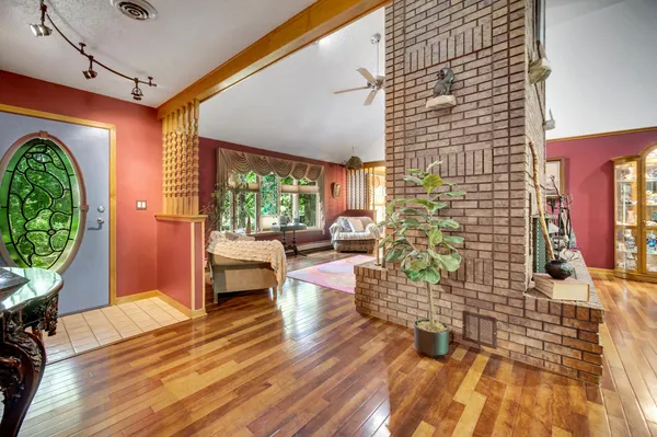 a bedroom with furniture and a fireplace