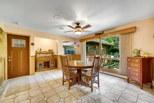 a kitchen with stainless steel appliances granite countertop a sink refrigerator and microwave