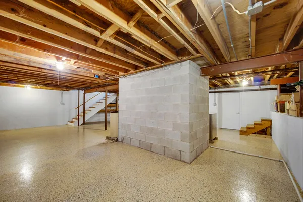 a view of a studio with wooden floor
