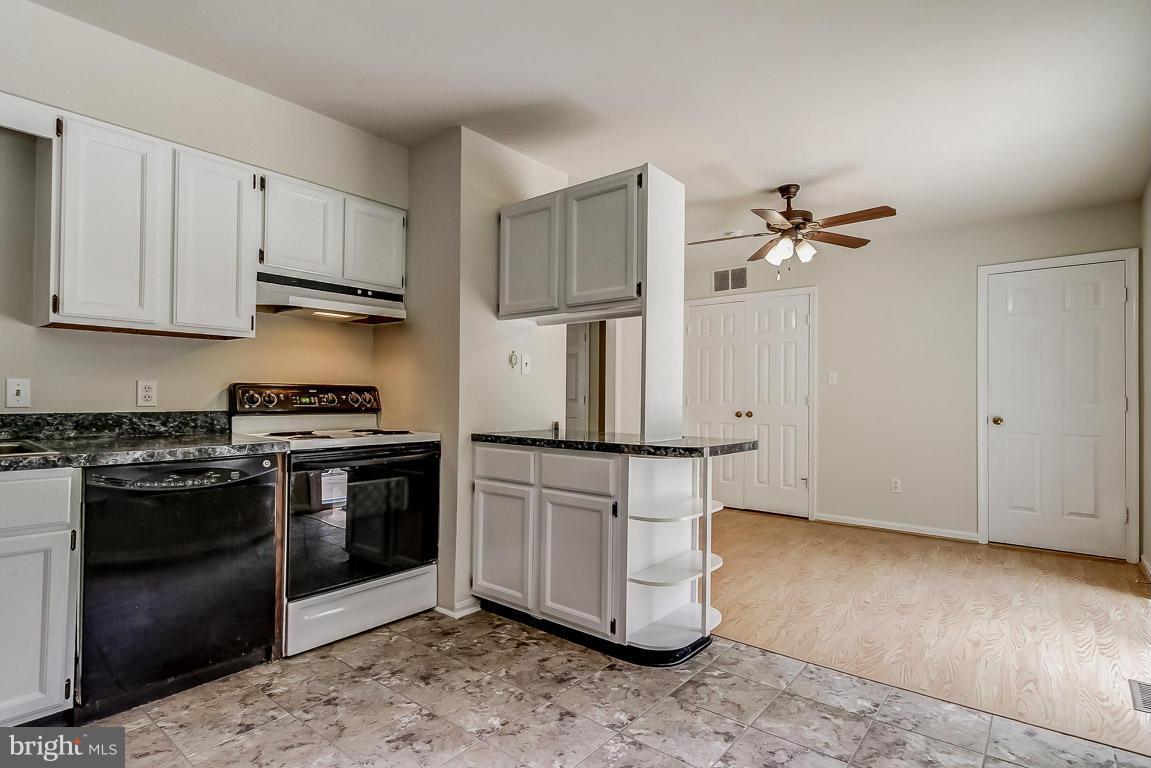 13367 Union Church Road Sumerduck, VA 22742 - Photo 14 of 30 a kitchen with stainless steel appliances granite countertop a stove a refrigerator and a cabinets