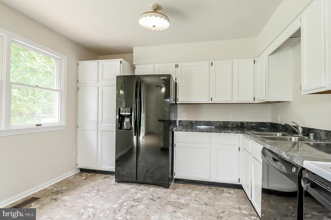 13367 Union Church Road Sumerduck, VA 22742 - Photo 17 of 30 a kitchen with stainless steel appliances granite countertop a refrigerator a stove and a sink