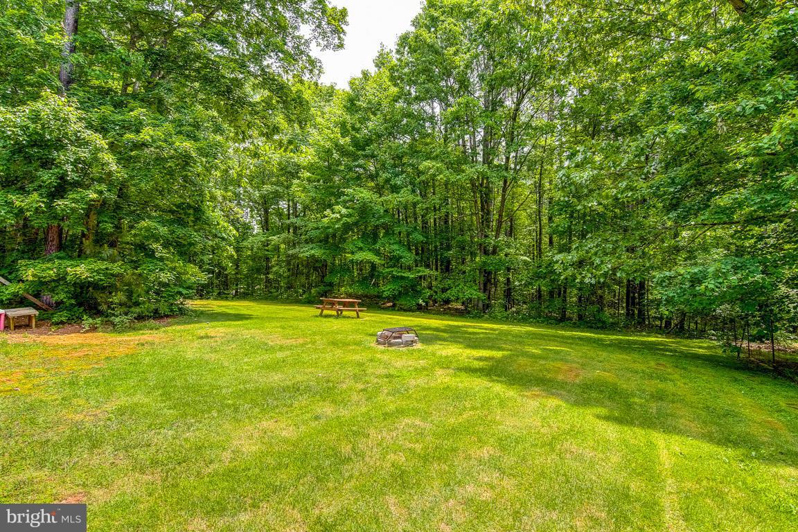 13367 Union Church Road Sumerduck, VA 22742 - Photo 3 of 30 a view of a swimming pool with an outdoor space and seating area