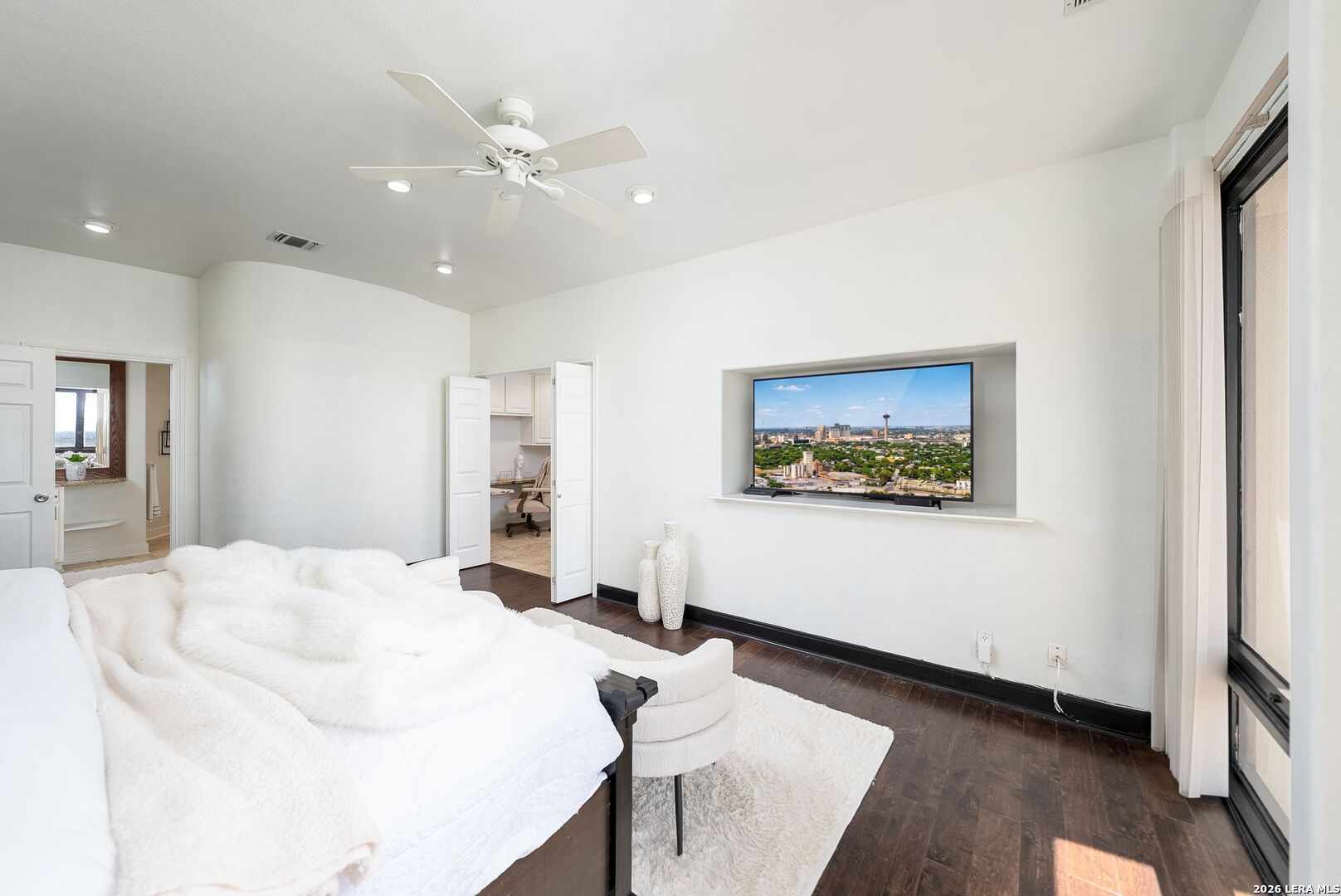 7701 Wurzbach Road, Unit 2302 San Antonio, TX 78229 - Photo 15 of 49 a living room with furniture and a flat screen tv