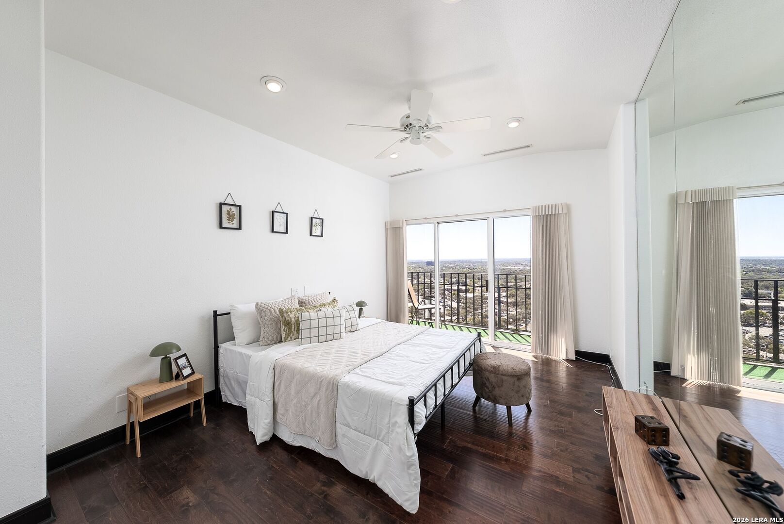 7701 Wurzbach Road, Unit 2302 San Antonio, TX 78229 - Photo 21 of 49 a bedroom with a bed and a chandelier